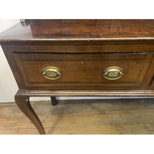 1570 - An oak dresser, the base with three drawers, 189 cm wide