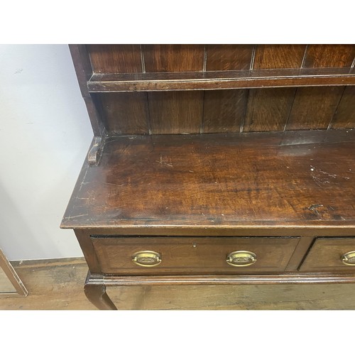 1570 - An oak dresser, the base with three drawers, 189 cm wide