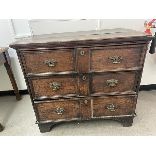 1627 - An oak chest, having three drawers, 105 cm wide