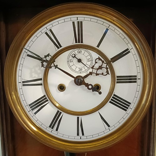 1525 - A Vienna regulator wall clock, with an enameled dial, subsidiary seconds dial, to a twin train eight... 