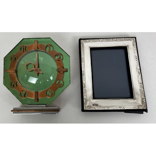 1443 - An American Art Deco bedside clock,a cigarette case, a Art deco glass clock, silver photo frame and ... 