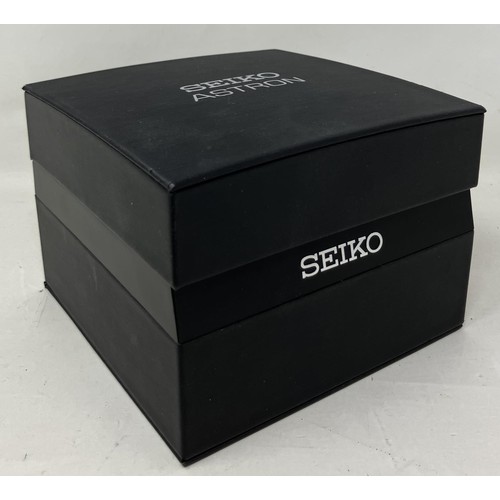 4 - A gentleman's titanium Seiko Astron GPS Solar wristwatch, boxed, with certificate, manual, and spare... 