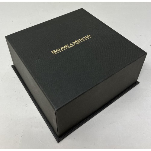 21 - A gentleman's stainless steel Baume and Mercier Geneve Automatic wristwatch, boxed, with instruction... 