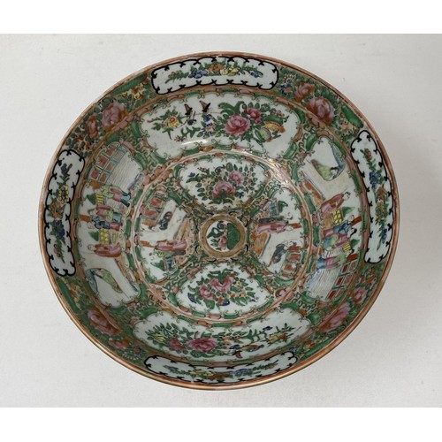 1501 - A Cantonese famille rose bowl, decorated figures and foliage, 27.5 cm diameter