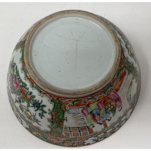 1501 - A Cantonese famille rose bowl, decorated figures and foliage, 27.5 cm diameter