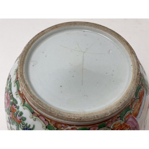 1501 - A Cantonese famille rose bowl, decorated figures and foliage, 27.5 cm diameter