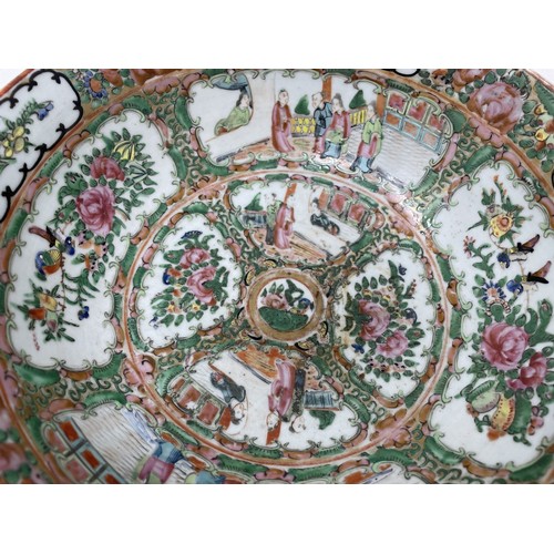 1501 - A Cantonese famille rose bowl, decorated figures and foliage, 27.5 cm diameter