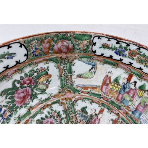 1501 - A Cantonese famille rose bowl, decorated figures and foliage, 27.5 cm diameter