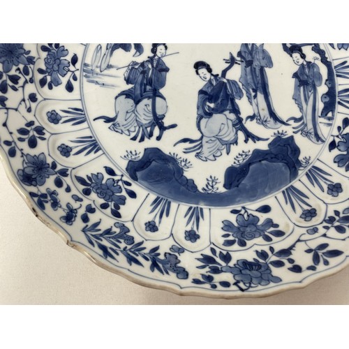 1502 - A Chinese porcelain dish, of lobed circular form, decorated lady musicians, other figures and foliag... 