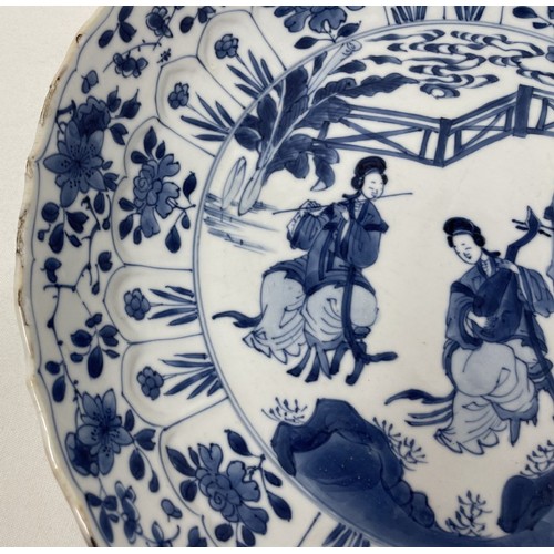 1502 - A Chinese porcelain dish, of lobed circular form, decorated lady musicians, other figures and foliag... 