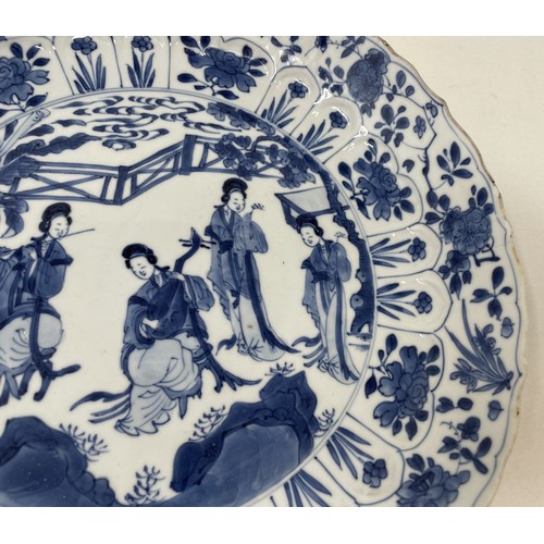 1502 - A Chinese porcelain dish, of lobed circular form, decorated lady musicians, other figures and foliag... 