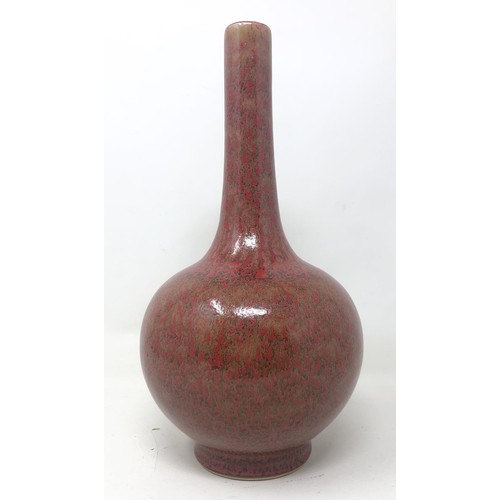 1506 - A Chinese red ground bottle vase, six character mark to base, 23 cm high