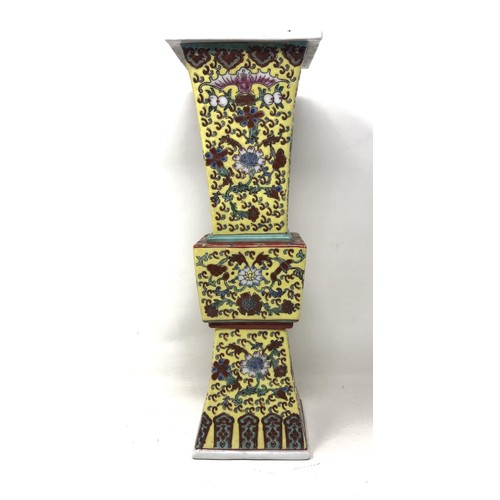 1524 - A Chinese yellow ground vase, with a four character mark, 37 cm high