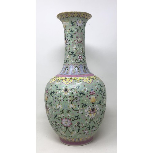 1527 - A Chinese vase, decorated flowers in enamel colours, character mark to base, 36 cm high