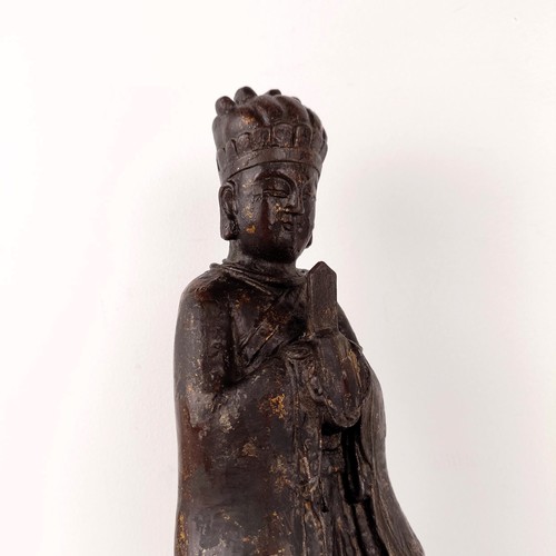 1557 - A Chinese Ming style iron buddha holding a sceptre, with splashed decoration, seal mark with six cha... 