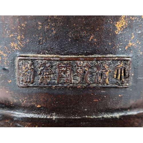 1557 - A Chinese Ming style iron buddha holding a sceptre, with splashed decoration, seal mark with six cha... 