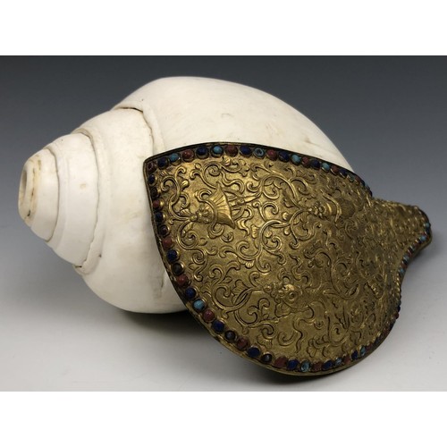 1594 - A Chinese conch shell trumpet, with a gilt bronze flange decorated in relief, with the eight Buddhis... 