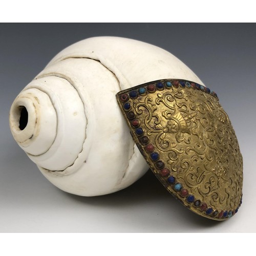 1594 - A Chinese conch shell trumpet, with a gilt bronze flange decorated in relief, with the eight Buddhis... 