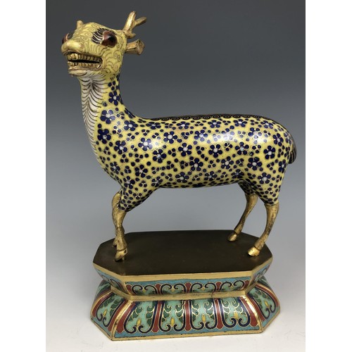 1597 - A Chinese cloisonné figure of a stag, standing on a lotus leaf style base, probably Qing Dynasty, 18... 