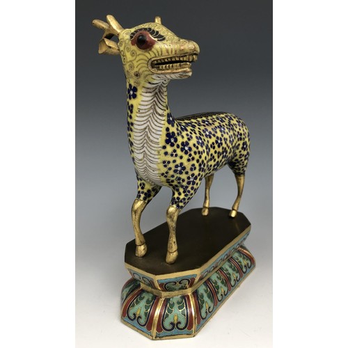 1597 - A Chinese cloisonné figure of a stag, standing on a lotus leaf style base, probably Qing Dynasty, 18... 