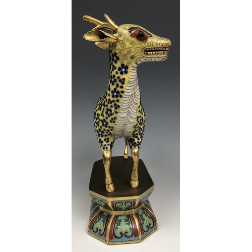 1597 - A Chinese cloisonné figure of a stag, standing on a lotus leaf style base, probably Qing Dynasty, 18... 