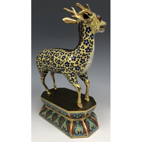 1597 - A Chinese cloisonné figure of a stag, standing on a lotus leaf style base, probably Qing Dynasty, 18... 