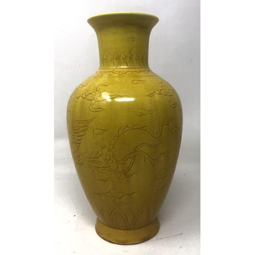 1605 - A Chinese yellow ground vase, decorated dragon, six character mark to base, 20 cm high