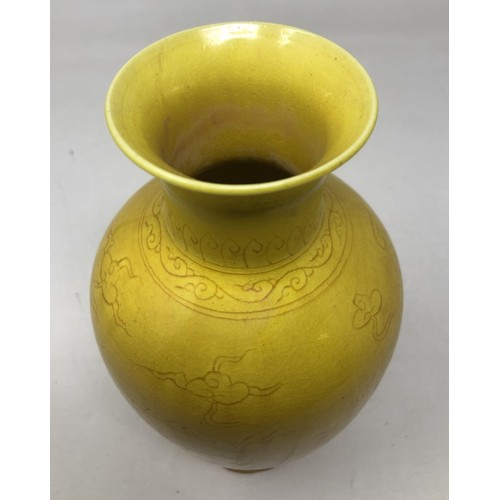 1605 - A Chinese yellow ground vase, decorated dragon, six character mark to base, 20 cm high