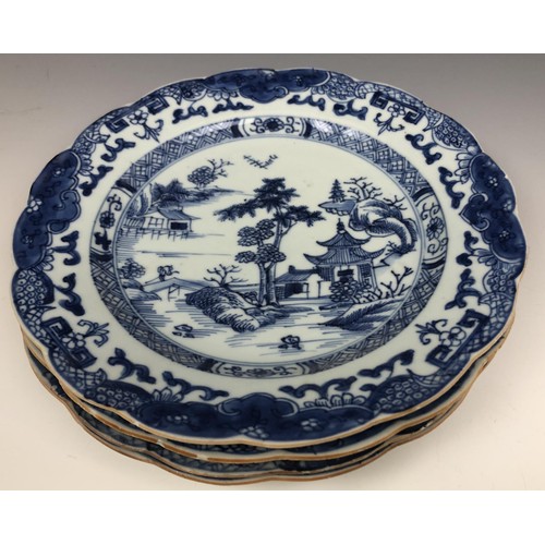 1606 - A set of four Chinese plates, decorated landscapes in underglaze blue