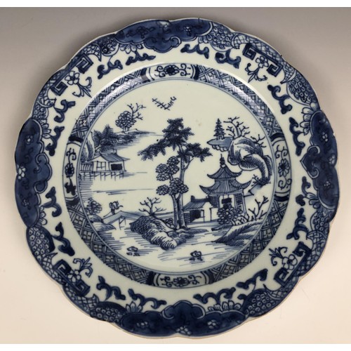 1606 - A set of four Chinese plates, decorated landscapes in underglaze blue