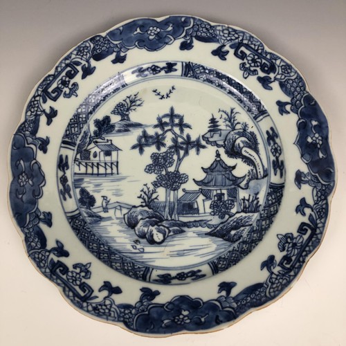 1606 - A set of four Chinese plates, decorated landscapes in underglaze blue