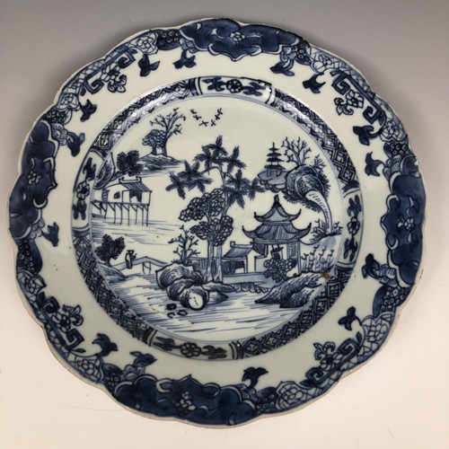 1606 - A set of four Chinese plates, decorated landscapes in underglaze blue