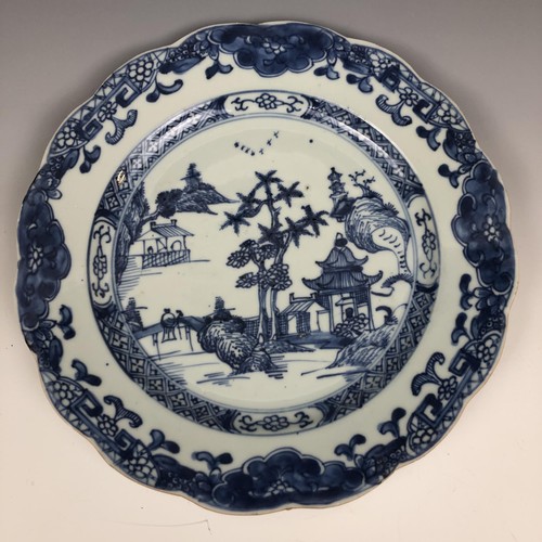 1606 - A set of four Chinese plates, decorated landscapes in underglaze blue