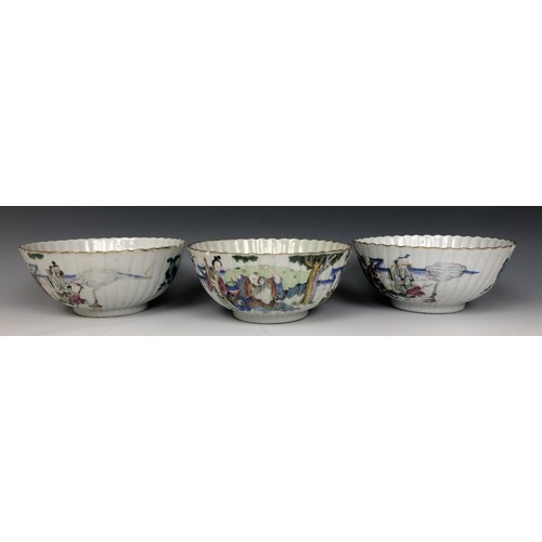 1620 - A set of three Chinese bowls, of lobed circular form, decorated figures in famille rose enamel colou... 