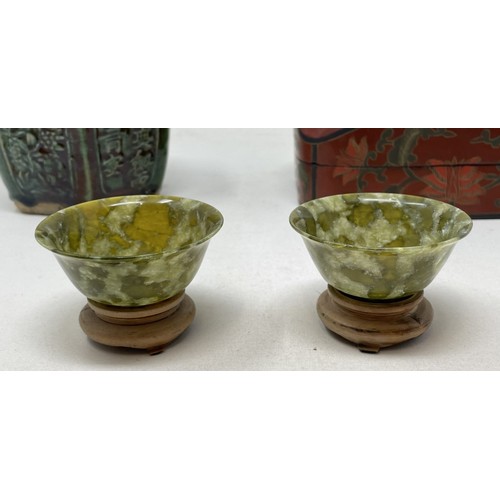 1510 - A pair of green stone bowls, on stands, 7.5 cm diameter, a green glazed ginger jar, and a laquered b... 