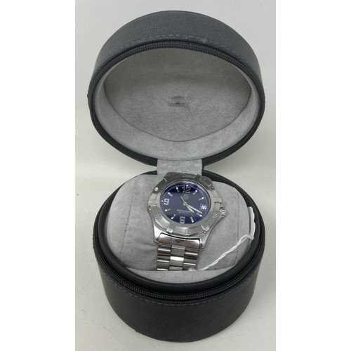 123 - A gentleman's stainless steel Tag Heuer Professional 200 Meters wristwatch, with a blue dial and bra... 