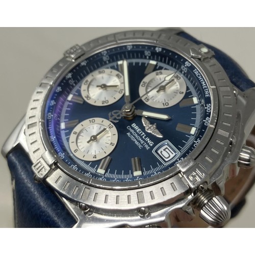 128 - A gentleman's stainless steel Breitling Chronometre Automatic wristwatch, with a blue dial, on a blu... 