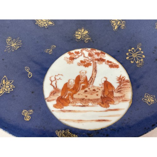 1503 - A Chinese powder blue charger, with three roundels, decorated figures, 33 cm diameter