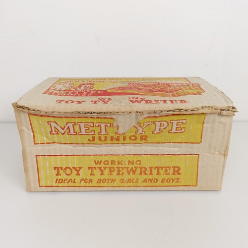 1844 - A Mettype Junior tinplate toy typewriter, boxed, a Pedigree Pretty Peepers doll, boxed, a Vulcan chi... 