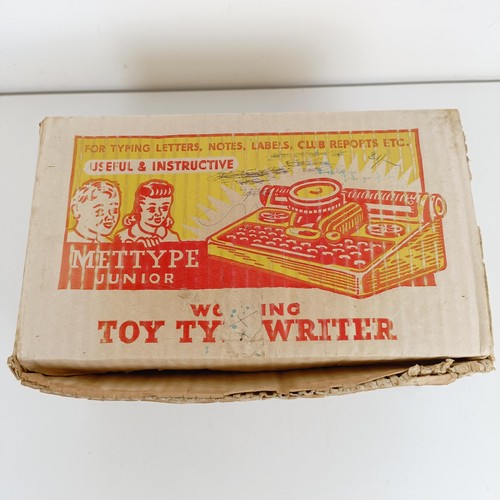 1844 - A Mettype Junior tinplate toy typewriter, boxed, a Pedigree Pretty Peepers doll, boxed, a Vulcan chi... 