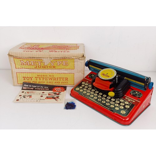 1844 - A Mettype Junior tinplate toy typewriter, boxed, a Pedigree Pretty Peepers doll, boxed, a Vulcan chi... 