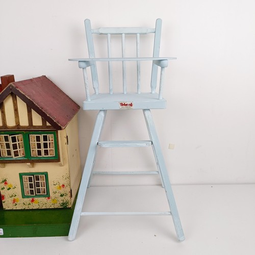 1912 - A Tri-ang style dolls house, assorted furniture, a doll size highchair, and a dolls tea set (qty)