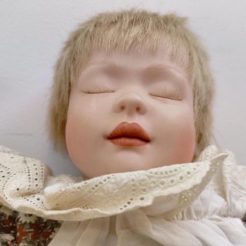 1910 - A bisque head doll, and other dolls (box)