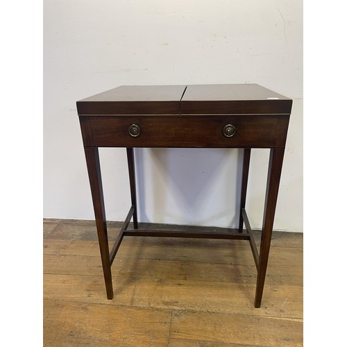 1922 - A 19th century mahogany enclosed dressing table, the folding top to reveal an adjustable mirror, and... 