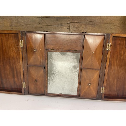 1922 - A 19th century mahogany enclosed dressing table, the folding top to reveal an adjustable mirror, and... 