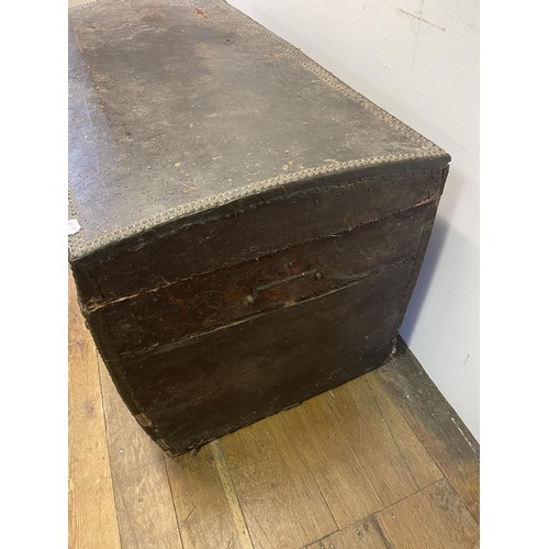 1923 - A leather studded trunk, with metal mounts, 125 cm wide