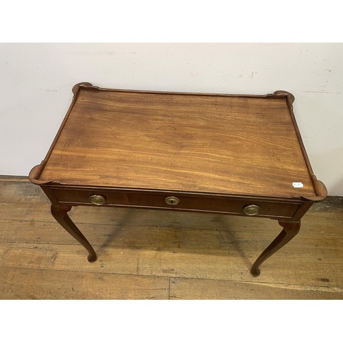 1926 - A Dutch mahogany table, having a raised rim, with a single frieze drawer on cabriole legs and pad fe... 