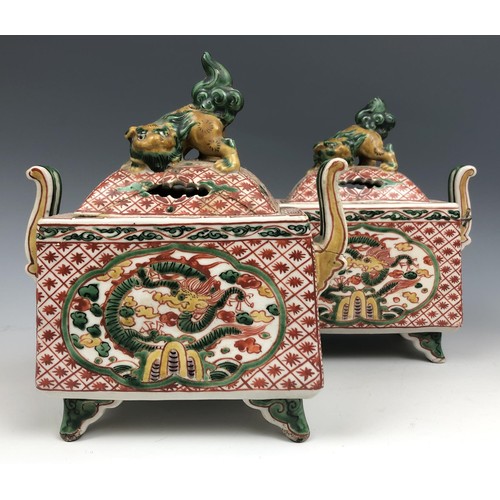 1585 - A pair of Chinese two handled censers and covers, decorated dragons, 17 cm high (2)