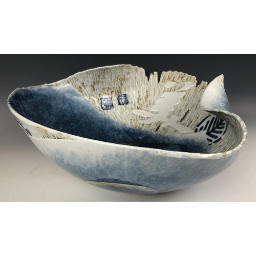 1522 - A modern Japanese art pottery bowl, of irregular form, decorated fish, signed, 46 cm wide