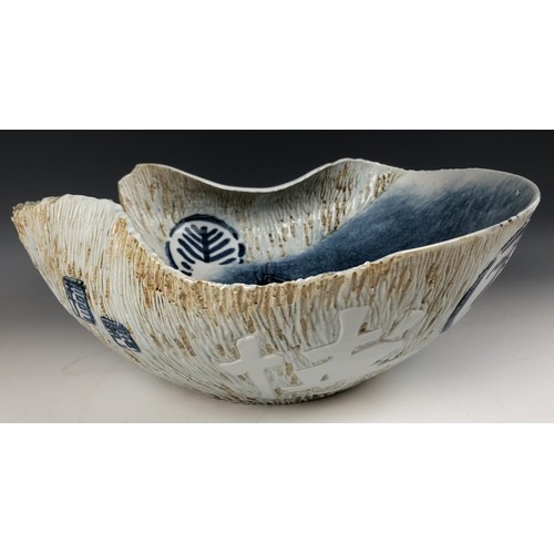 1522 - A modern Japanese art pottery bowl, of irregular form, decorated fish, signed, 46 cm wide